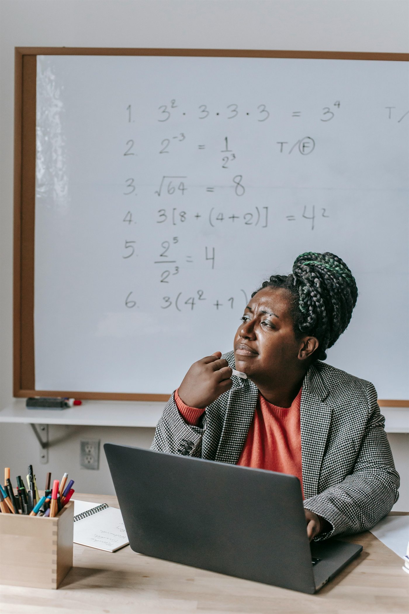 Teacher reflecting in a classroom